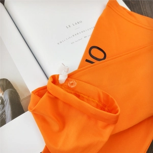Orange ice silk sun protection sleeve with elastic drawstring and clear button detail