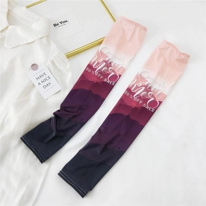 Detail view of pink gradient sun protection ice silk sleeves with summer print
