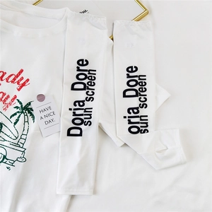 Detail of white cooling ice silk sun sleeves and matching printed tee with palm tree