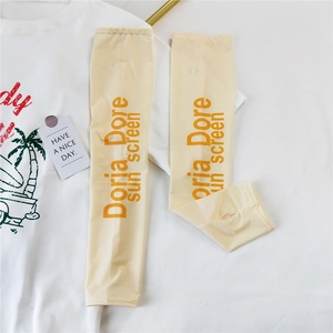 Detail of yellow ice silk arm sleeves with thumb holes and Doria Dore sun screen print