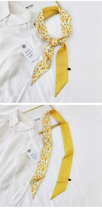 Detail of citrus print silk scarf with Positive Thinking embroidery and yellow satin back