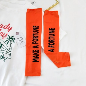 Detail of vibrant orange sun sleeves with black Make A Fortune text and thumb hole design