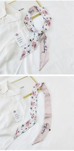 Detail of pink silk twilly scarf with ballerina print and Positive Thinking text