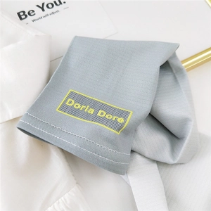 Gradient ice silk sun protection arm sleeves with yellow Doria Dore logo in gray