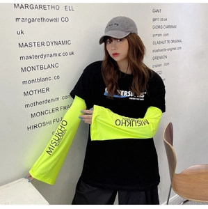 Detail of neon green loose cooling sun sleeves with black branded sunscreen lettering