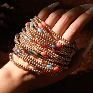 Handmade woven CCB bracelet set with colorful resin beads and gold-tone layered beads