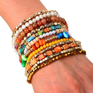 Close-up of 12-piece bohemian stretch bead bracelets with colorful marble stone and pearls