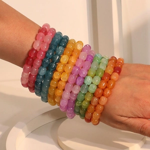 Colorful crackle glass bead bracelets set with vibrant translucent ice texture crystals