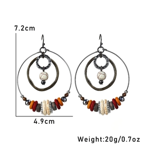 Detail of Bohemian multi-layered hoop earrings with white crackle and colorful resin beads