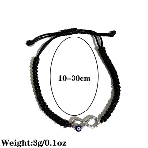 Detail of adjustable black cord bracelet with infinity symbol and blue evil eye bead
