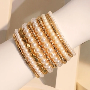 Elegant multi-layer set of 10 white faux pearl and gold beaded elastic stretch bracelets