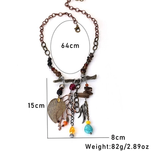 Detail view of Bohemian leaf necklace with turquoise beads and size dimensions shown