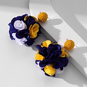 Detail of handmade fabric flower earrings with blue and yellow petals and beaded studs