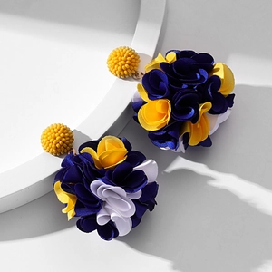 Handmade fabric flower cluster earrings in dark blue and yellow on white background