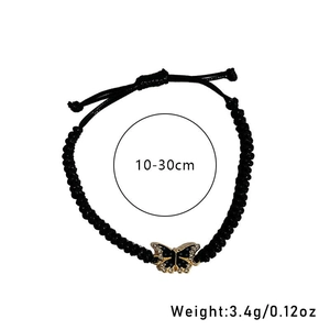 Adjustable black braided rope bracelet with a gold-tone butterfly pendant and crystals