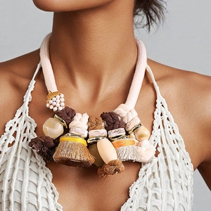 Bohemian statement necklace with pink braided rope, colorful tassels and beaded charms
