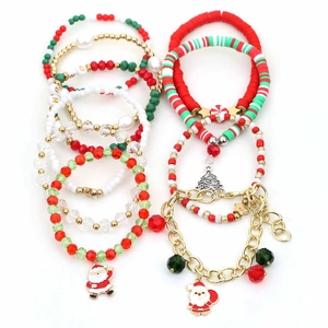 Christmas star bracelet set with santa pendants and colorful beads on white background