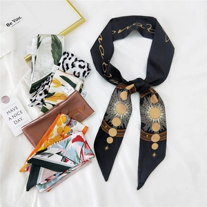 Elegant skinny silk scarf with sun pattern and various colors on white fabric