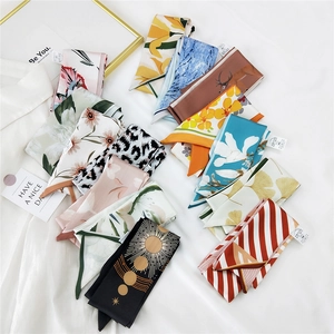 Elegant long skinny silk scarves for women featuring floral and leopard print patterns
