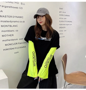 Detail of neon green ice silk sun sleeves featuring black MISUKHO SUNSCREEN lettering