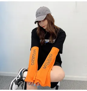 Close-up of orange sun protection sleeves with ice silk fabric and brand logo