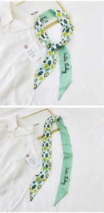 Detail of mint green twilly scarf with botanical prints and Positive Thinking lettering
