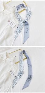 Detail of floral and purple twilly scarf tied on a bag handle for an elegant look