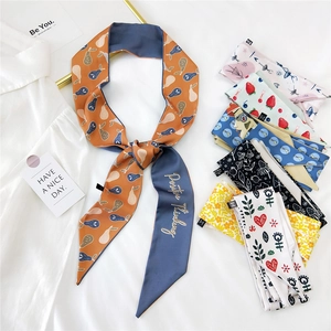 Elegant silk twilly scarf collection with diverse patterns and positive thinking embroidery