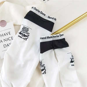 White ice silk sun protection sleeves with black cuffs and motivational typography