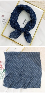 Close-up and flat lay of navy blue linen square scarf with yellow floral pattern