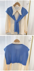 Detail view of cream long-sleeve shirt with royal blue knit shawl from front and back