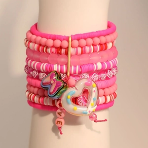 Pink multi-layer beaded bracelet set with clay beads, heart charms and bow pendants