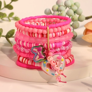 Pink layered clay bead bracelets featuring metallic butterfly and heart love charms