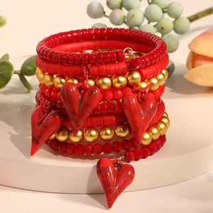 Bohemian multi-layer red beaded bracelet set with gold accents and heart charms