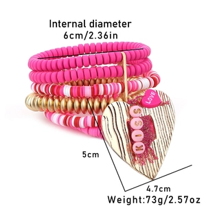 Detail view of pink polymer clay bead bracelet with KISS heart pendant and size dimensions