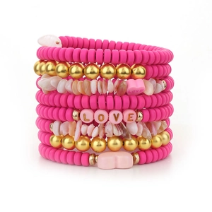 Multilayered pink heishi bead bracelet set with LOVE letter beads and gold accents