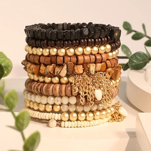 Bohemian multi-layer beaded bracelet set with earthy tones, gold tassels and wood beads