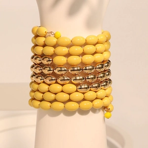 Bohemian multi-layer wrap bracelet with matte yellow beads and golden metallic accents