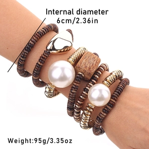 Bohemian stackable 7-piece acrylic and wood bead bracelet set worn on wrist