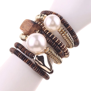 Bohemian 7-piece stacking bracelet set with acrylic beads and gold heart charms