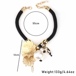 Bohemian maple leaf and faux pearl tassel necklace with black braided cord detail
