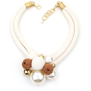 Elegant double-layer bohemian necklace with cream pearls and gold spheres on cotton rope