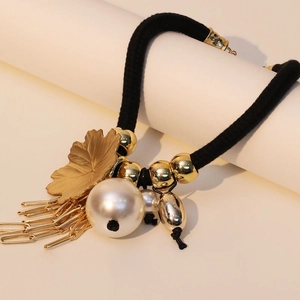Bohemian gold leaf and oversized pearl tassel necklace with black rope chain