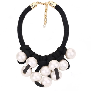 Exaggerated large pearl pendant necklace with black woven rope and gold lobster clasp