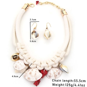 Bohemian handmade woven necklace and earring set with shell and red coral pendants