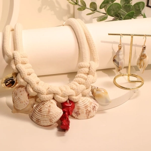 Bohemian style woven shell necklace and earrings jewelry set with red coral accent