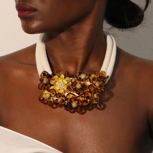 Amber acrylic flower choker necklace with white multi-layer cord and golden floral accents