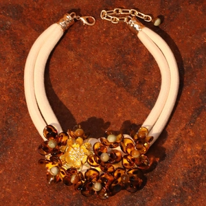 Amber acrylic flower statement necklace with cream braided double-layer rope and gold accents