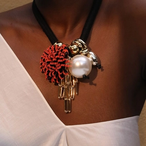 Exaggerated floral necklace with red polka dots, large pearl and golden tassels