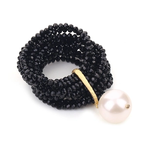 Elegant multi-layer black beaded stretch bracelet featuring a large white pearl pendant